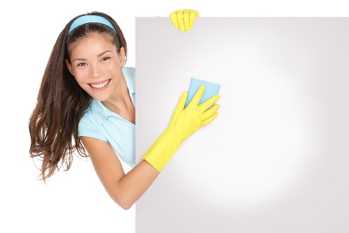 Office cleaners sanitising a modern Lambeth business interior
